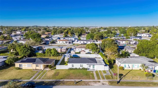 an aerial view of a yard with outdoor seating