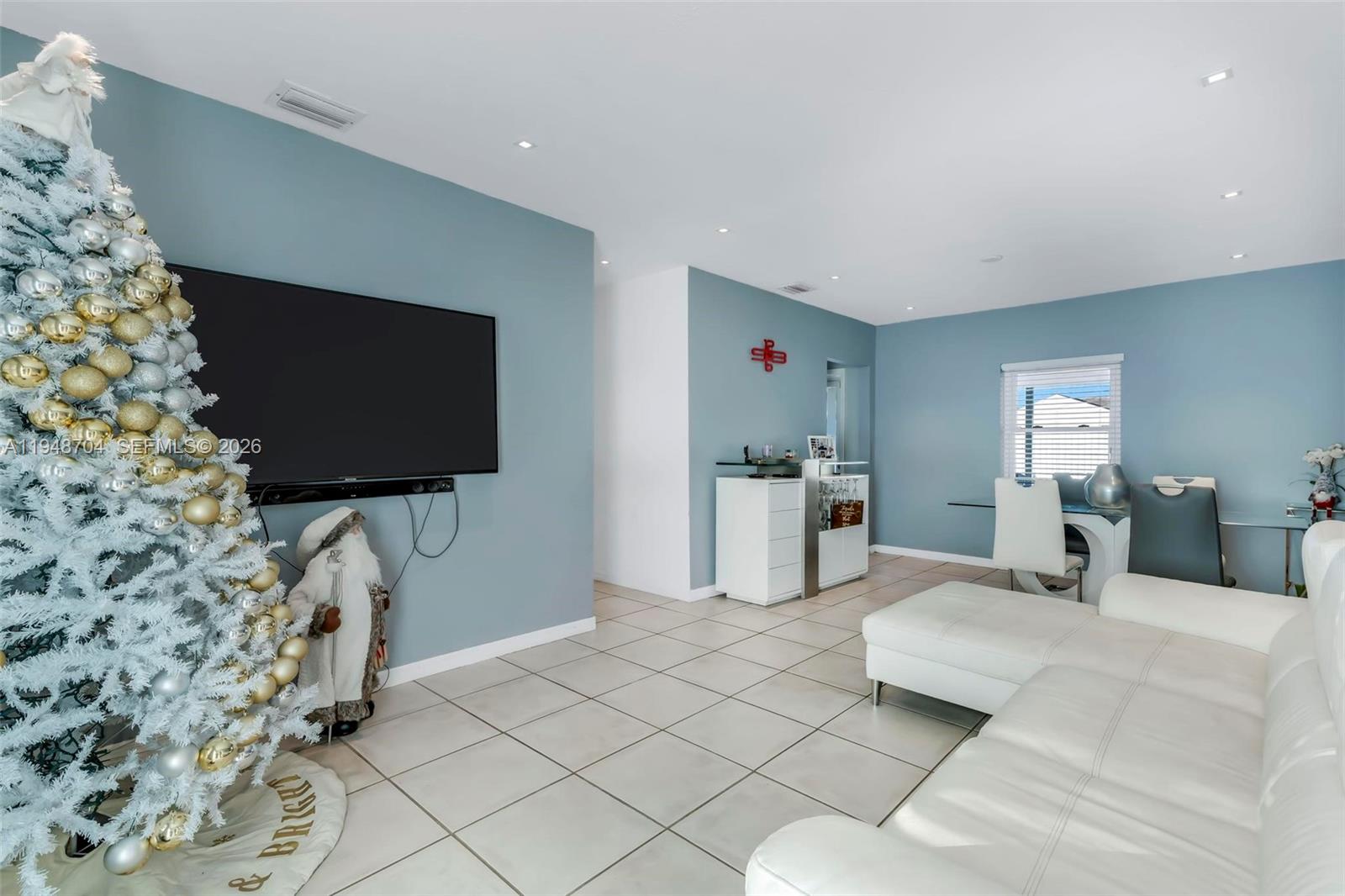 14860 Buchanan Street Miami, FL 33176 - Photo 3 of 27 a living room with furniture and a flat screen tv