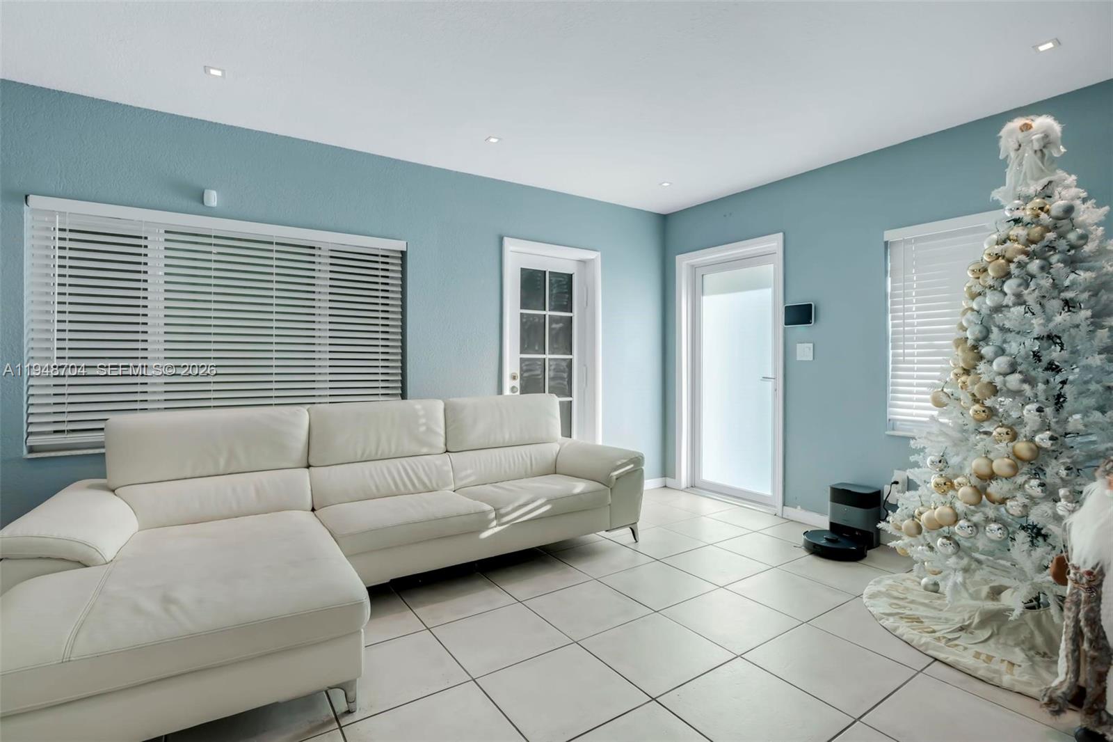 14860 Buchanan Street Miami, FL 33176 - Photo 4 of 27 a living room with furniture and a window