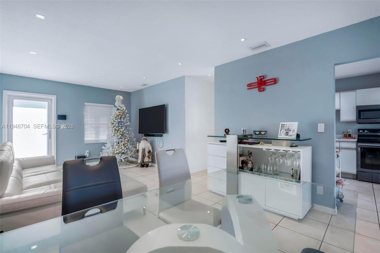 14860 Buchanan Street Miami, FL 33176 - Photo 7 of 27 a living room with furniture and a flat screen tv