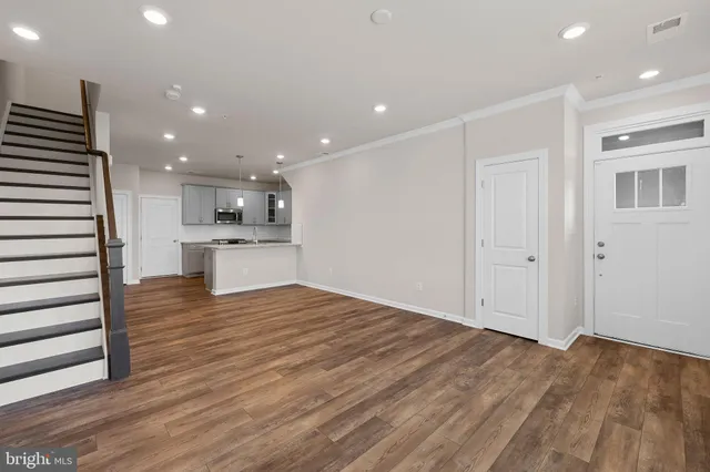 a view of kitchen with wooden floor