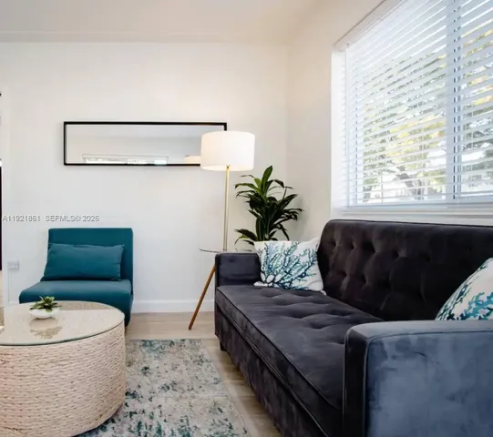 a living room with furniture and a bathtub