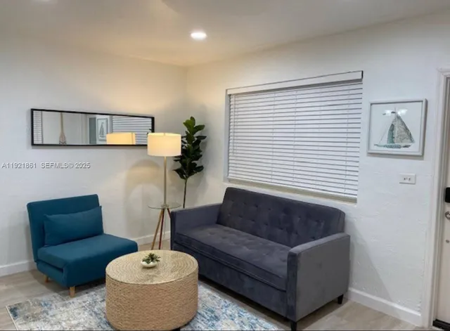 a living room with furniture and a window