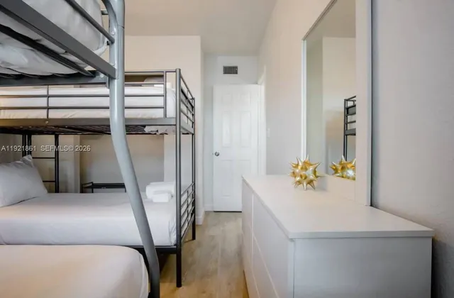 a bed room with a bed and furniture