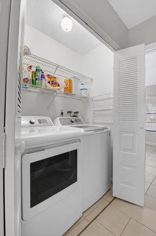 a utility room with washer and dryer