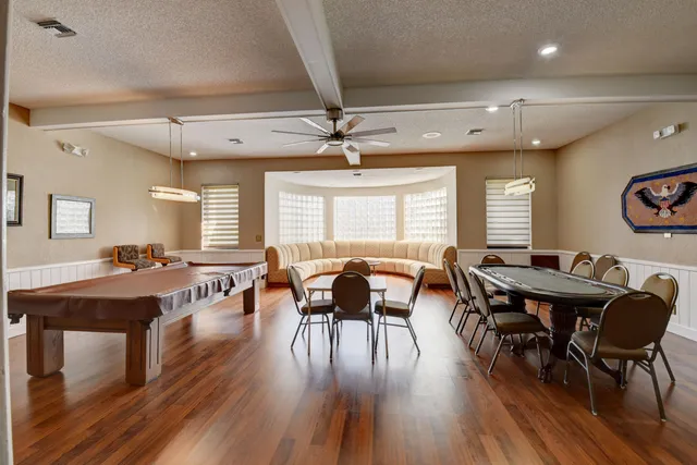 a view of room with table and chairs