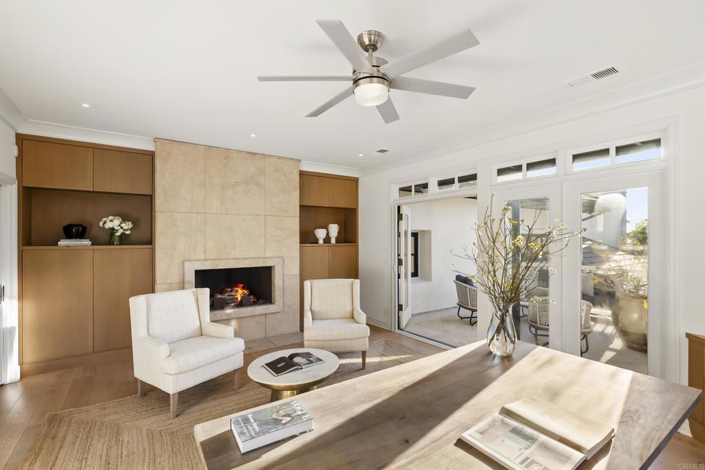7891 Muirfield Way Rancho Santa Fe, CA 92067 - Photo 12 of 26 a living room with furniture and a fireplace