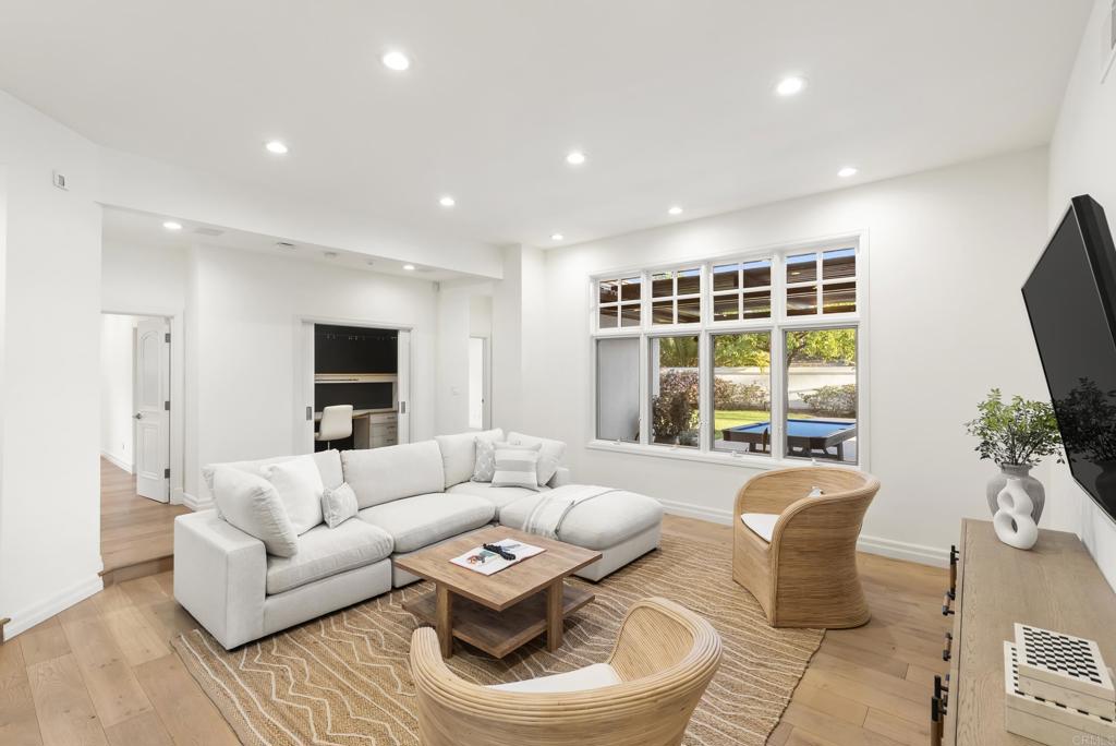 7891 Muirfield Way Rancho Santa Fe, CA 92067 - Photo 14 of 26 a living room with furniture and a large window