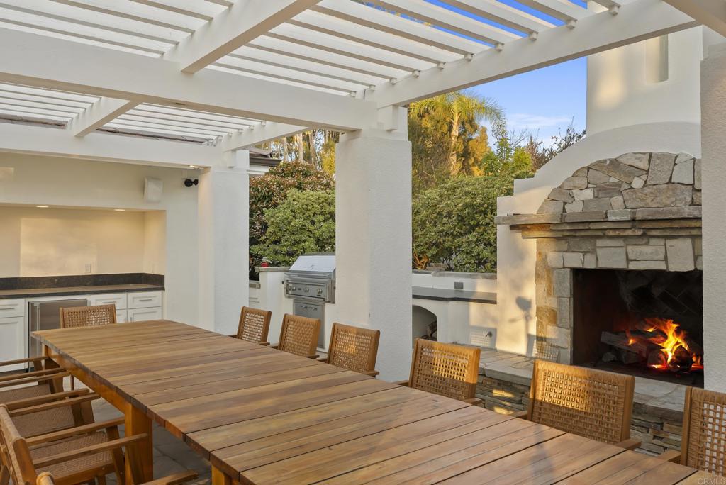 7891 Muirfield Way Rancho Santa Fe, CA 92067 - Photo 19 of 26 a bedroom with a bed and a fireplace