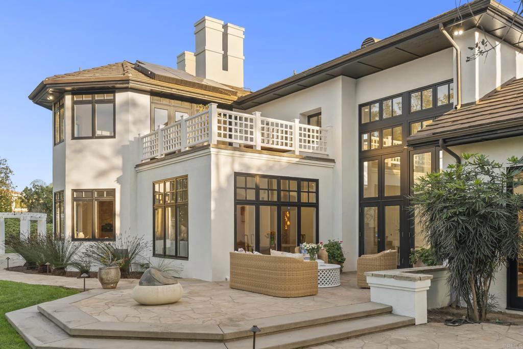 7891 Muirfield Way Rancho Santa Fe, CA 92067 - Photo 22 of 26 a front view of a house with a yard