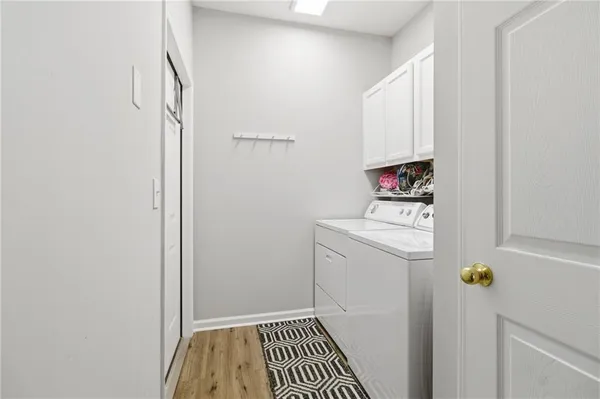 a view of hallway with washer and dryer
