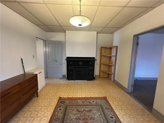 a kitchen with a refrigerator and cabinets