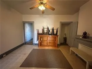 a kitchen with a stove and a chair