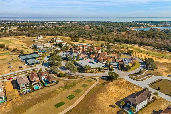 an aerial view of residential building and ocean