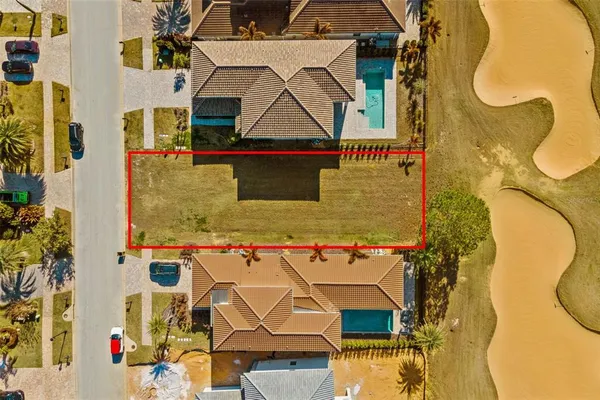 an aerial view of a house with swimming pool