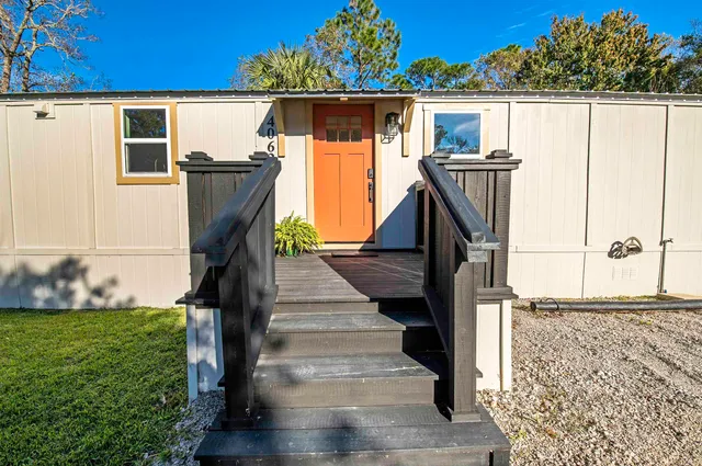 a view of entryway with flower garden and wooden floor