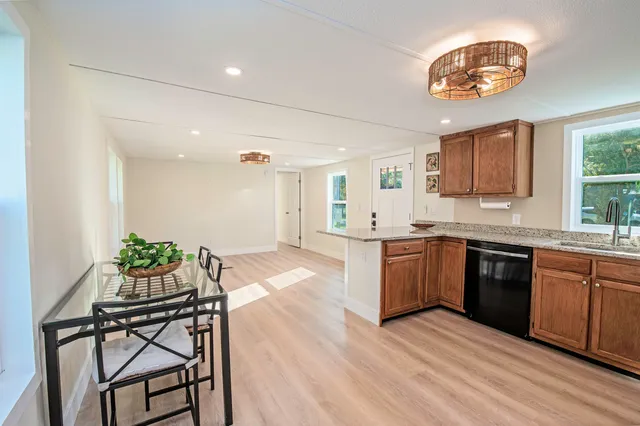 a kitchen with a table and chairs in it