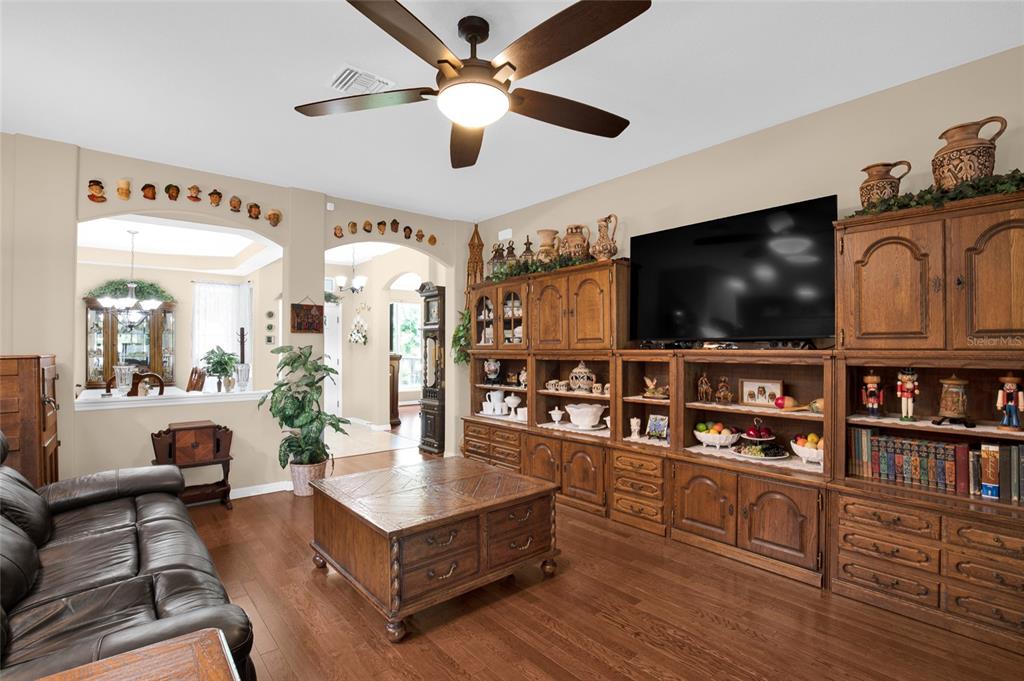 16411 Southwest 14th Avenue Road Ocala, FL 34473 - Photo 9 of 59 a living room with furniture and a flat screen tv