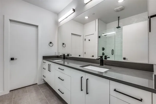 a bedroom with a bed and a clock on the wall