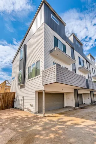 a backyard of a house with outdoor seating
