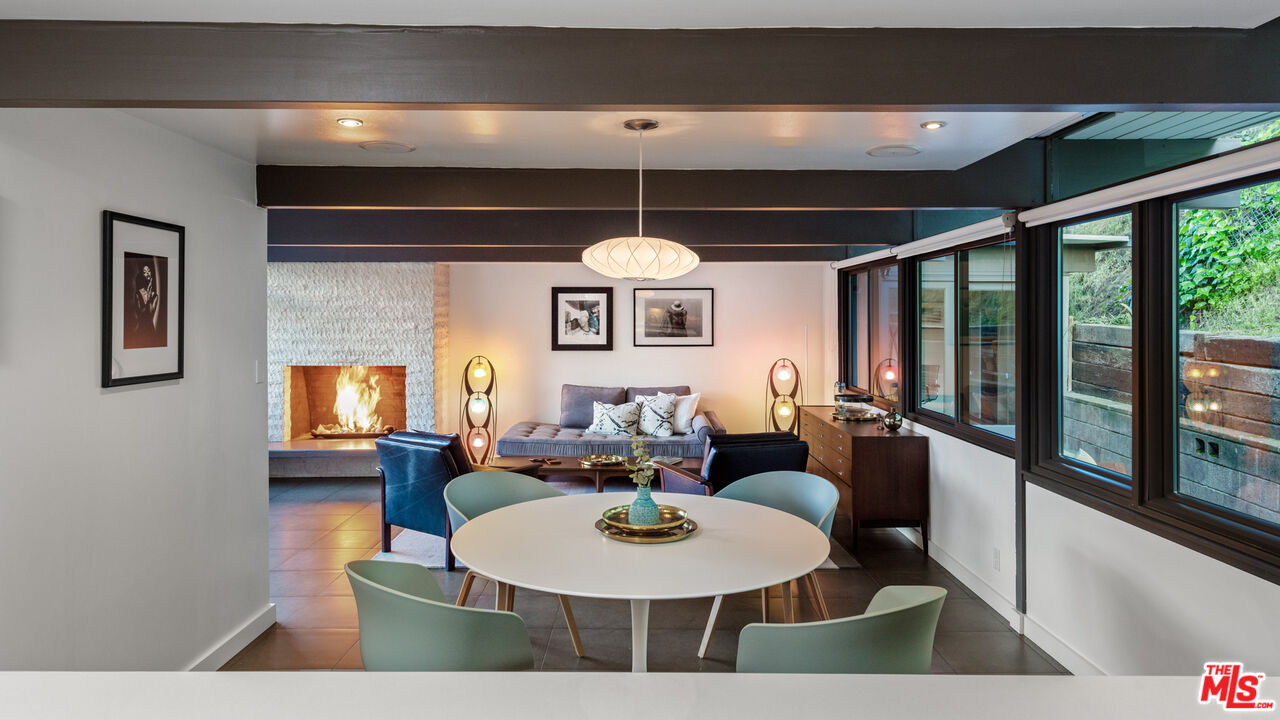 2430 Bywood Drive Glendale, CA 91206 - Photo 20 of 39 a dining room with furniture a window and a chandelier