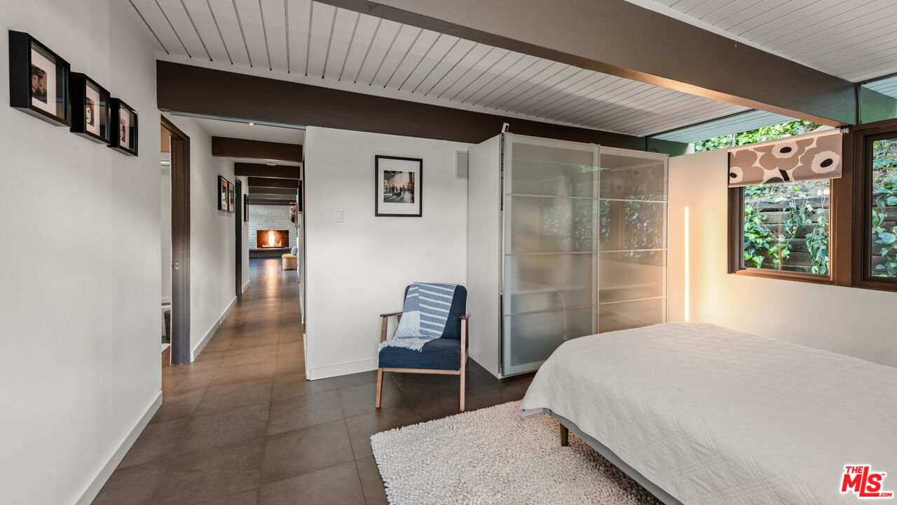 2430 Bywood Drive Glendale, CA 91206 - Photo 30 of 39 a bedroom with a bed and a chair with the wooden floor