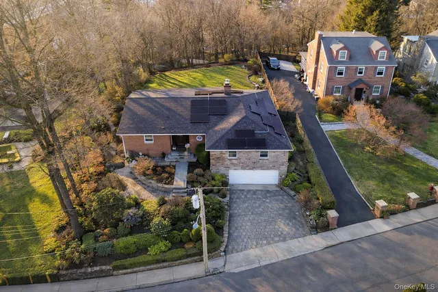 a kitchen with granite countertop a sink stainless steel appliances and cabinets