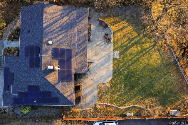 a aerial view of a house with a yard