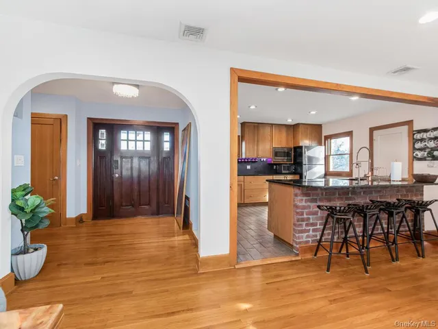 a view of a dining area with furniture and a potted plant
