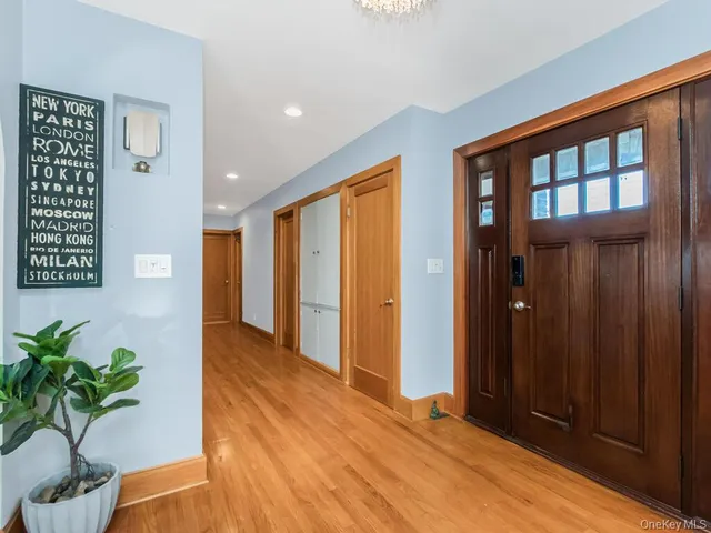 a view of entryway with wooden floor