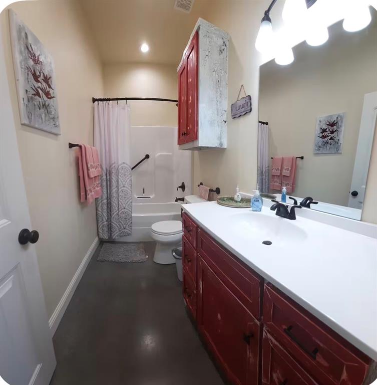 7565 Fm 3116 Anson, TX 79501 - Photo 11 of 15 Bathroom featuring a single vanity with a white countertop and red-finished cabinetry