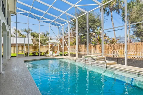 a view of a swimming pool with a patio