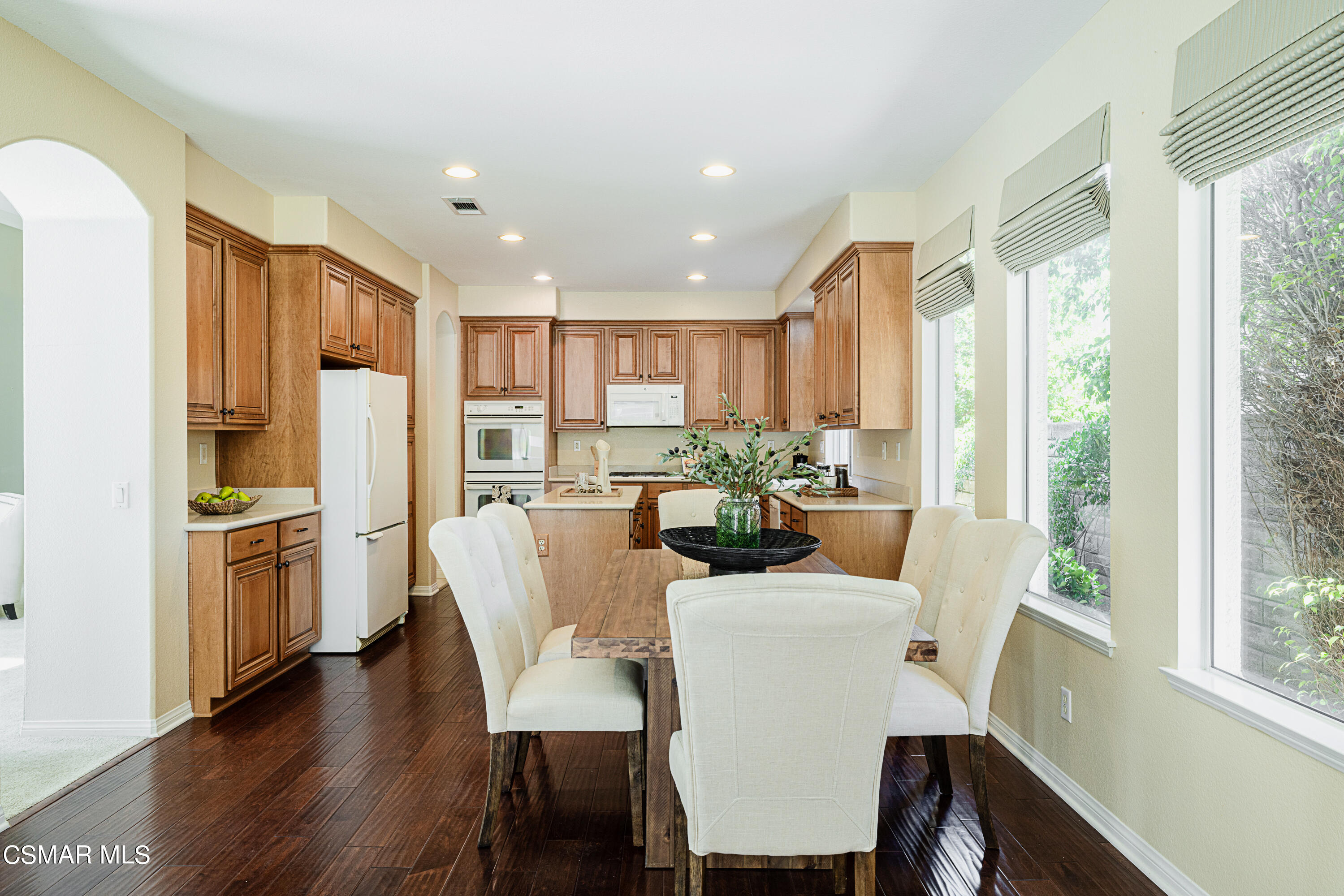931 North Wood Ranch Parkway Simi Valley, CA 93065 - Photo 11 of 33 a kitchen with kitchen island wooden cabinets and refrigerator