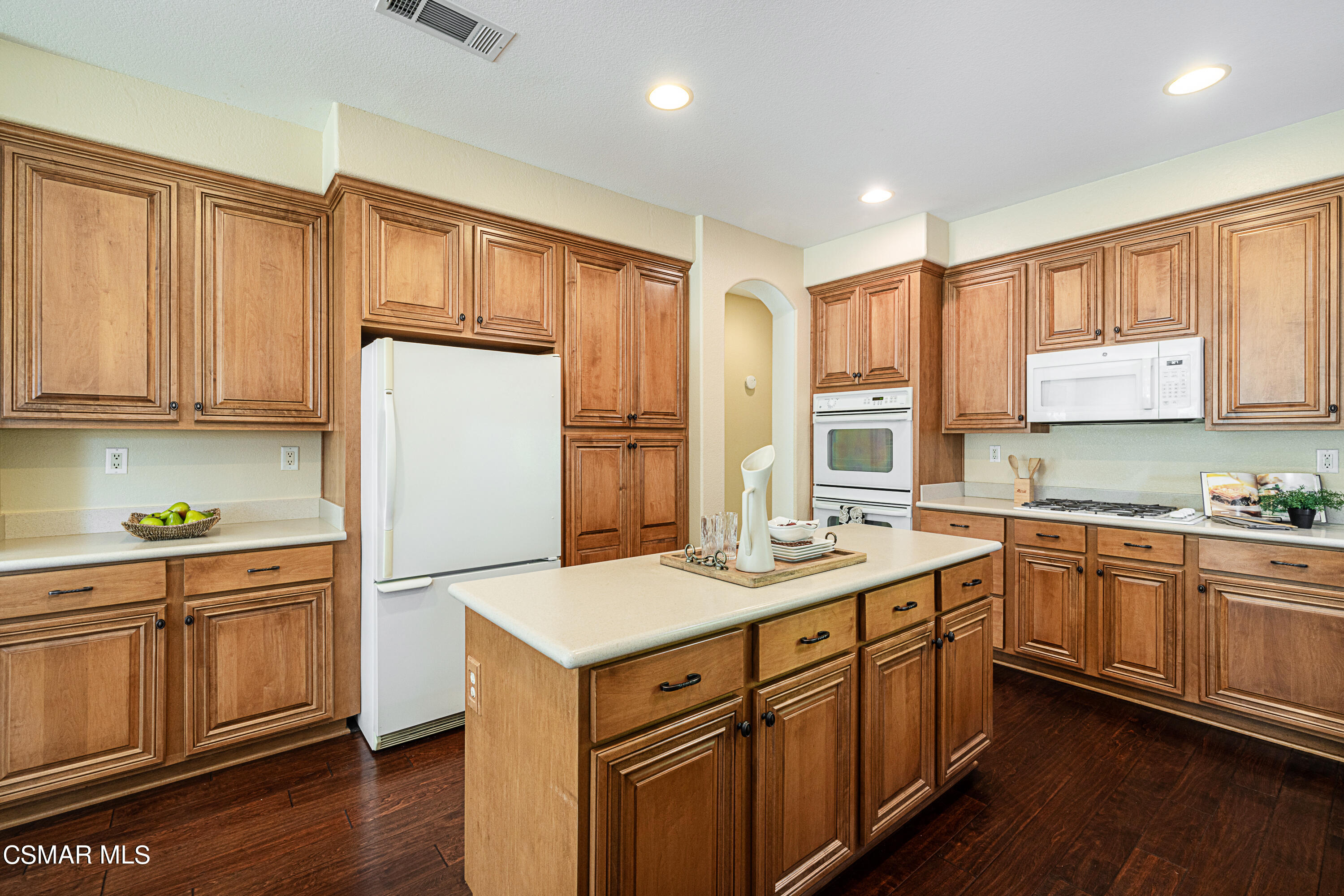 931 North Wood Ranch Parkway Simi Valley, CA 93065 - Photo 13 of 33 a kitchen with a sink refrigerator and cabinets