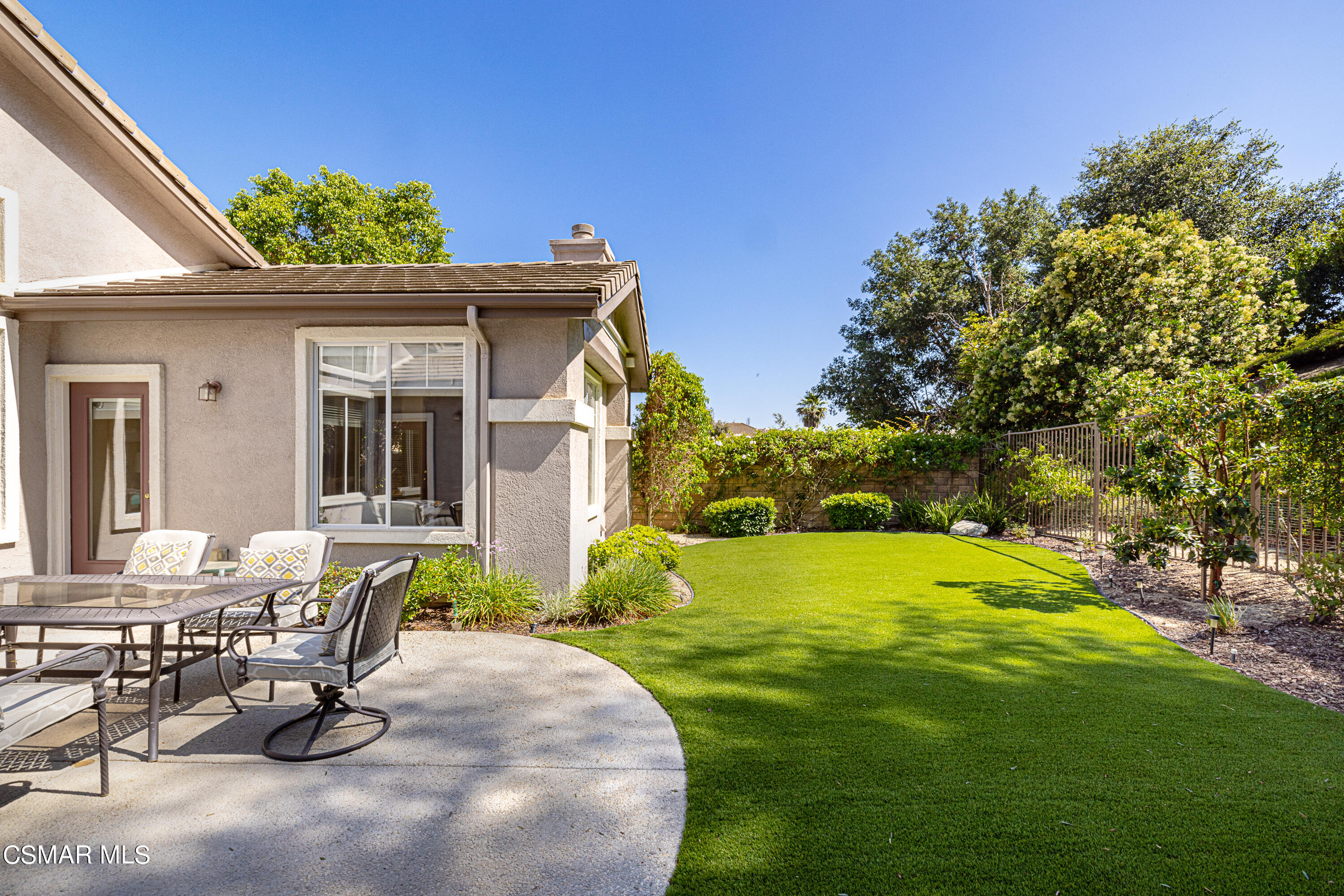 931 North Wood Ranch Parkway Simi Valley, CA 93065 - Photo 31 of 33 a view of a patio with table and chairs and potted plants