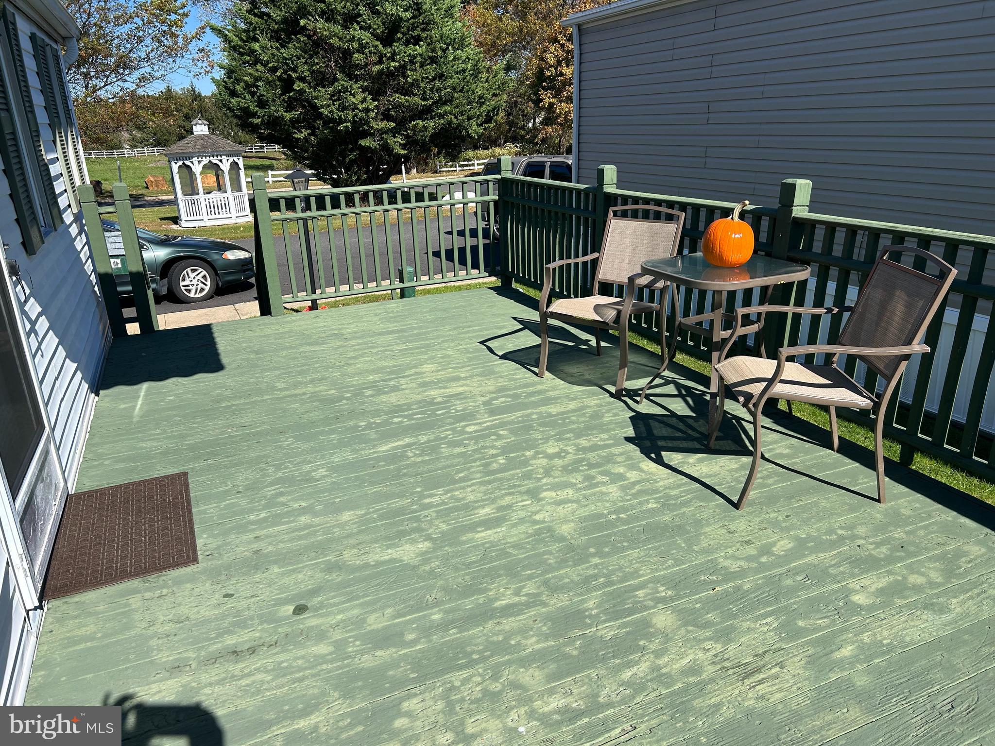 34 Winterset Road, Unit 11 Wilmington, DE 19810 - Photo 21 of 26 a balcony with chairs and wooden fence