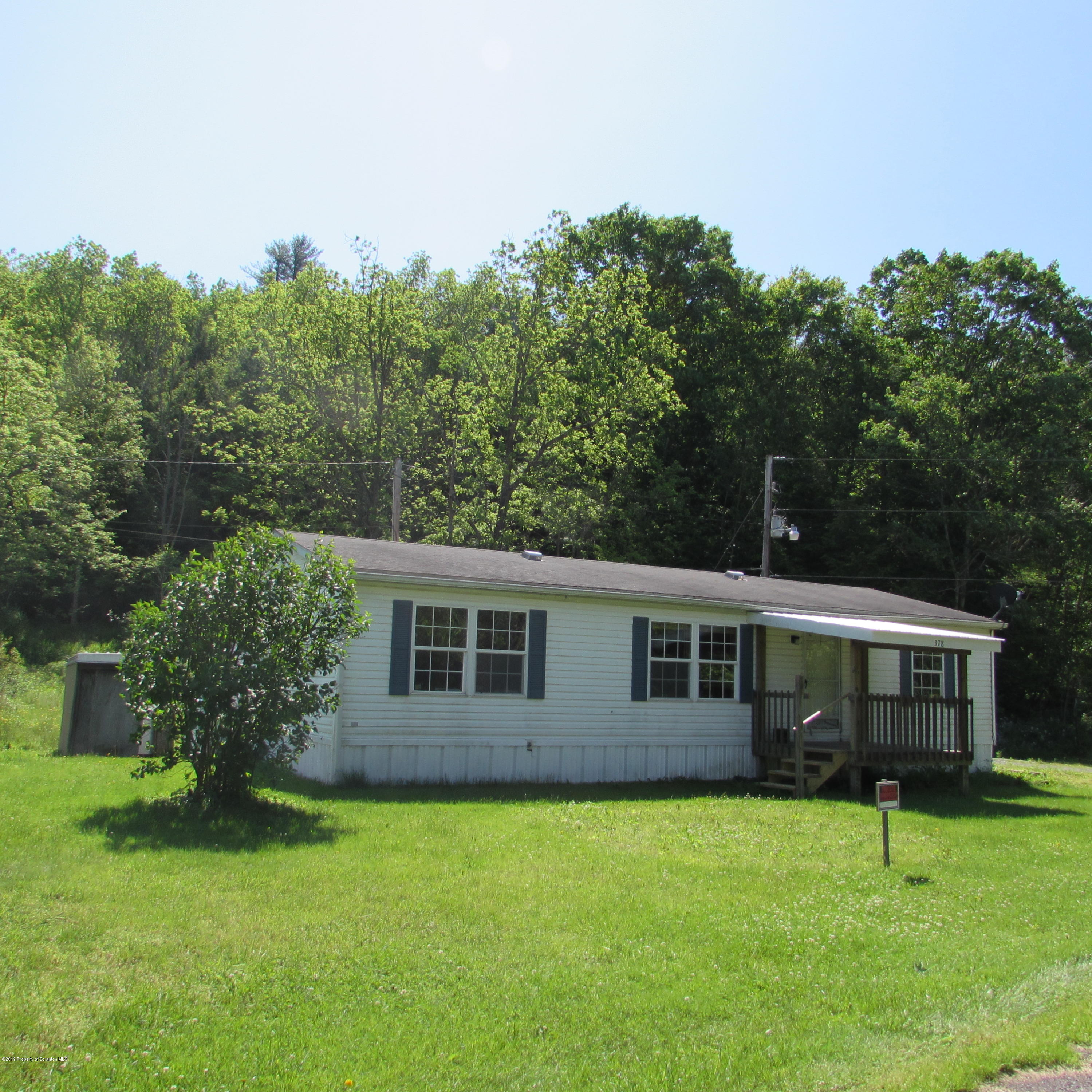 378 Williams Road Meshoppen, PA 18630 - Photo 1 of 8 front view of a house with a garden