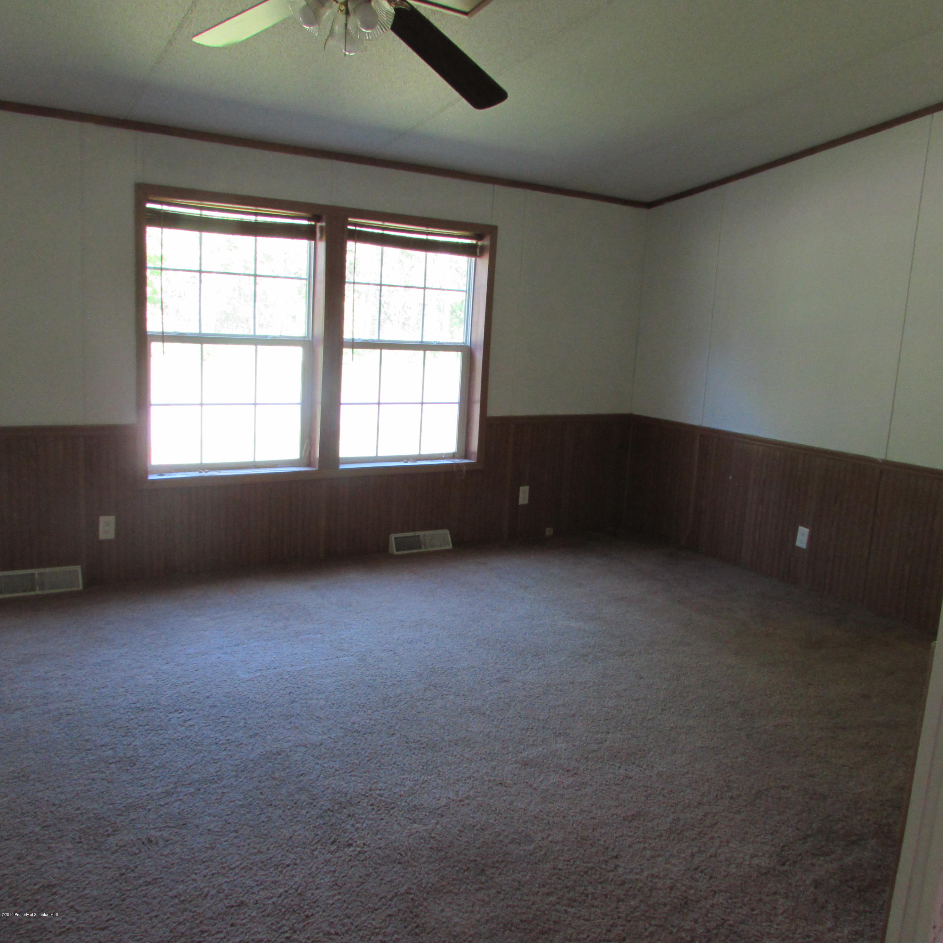 378 Williams Road Meshoppen, PA 18630 - Photo 3 of 8 an empty room with a window