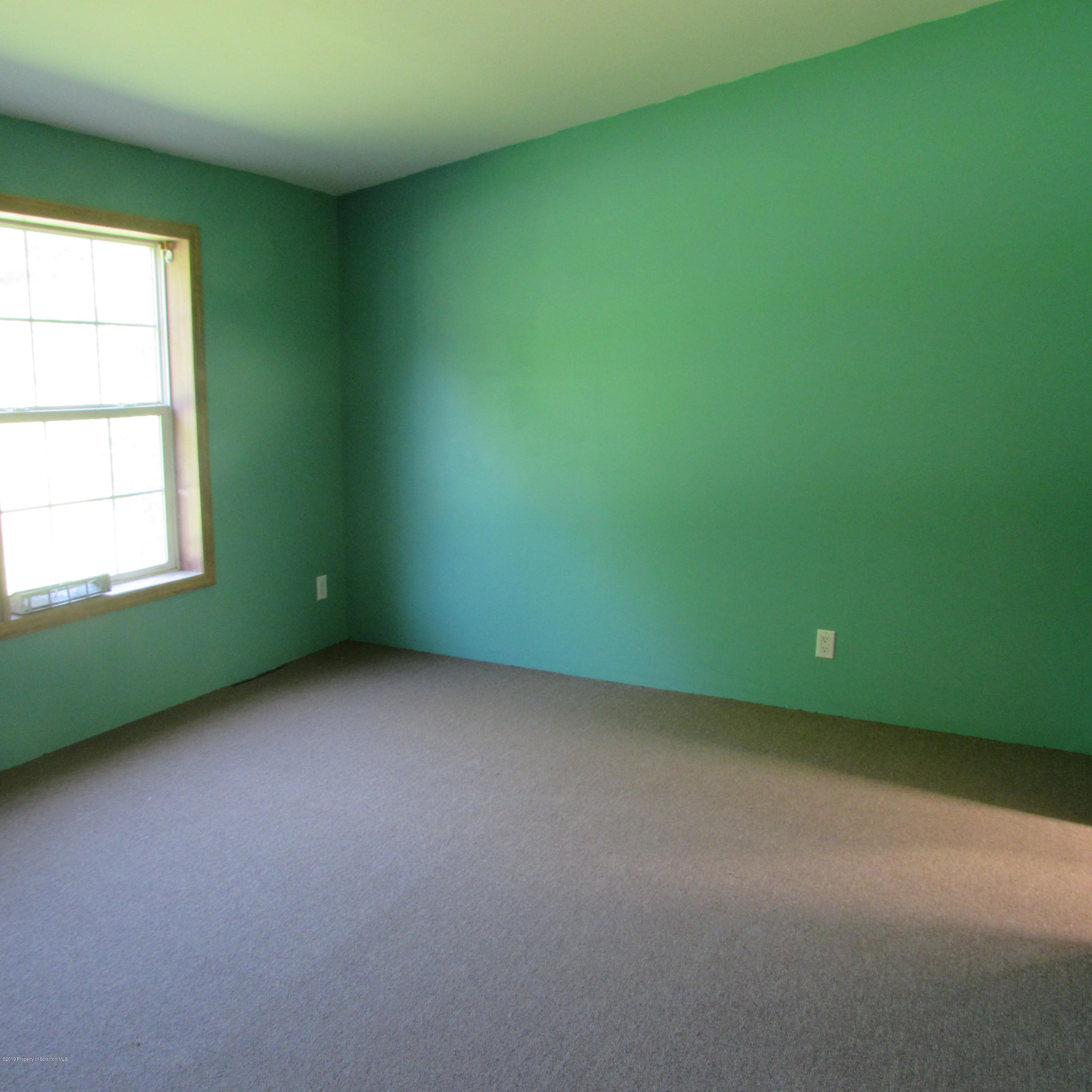 378 Williams Road Meshoppen, PA 18630 - Photo 4 of 8 an empty room with a window