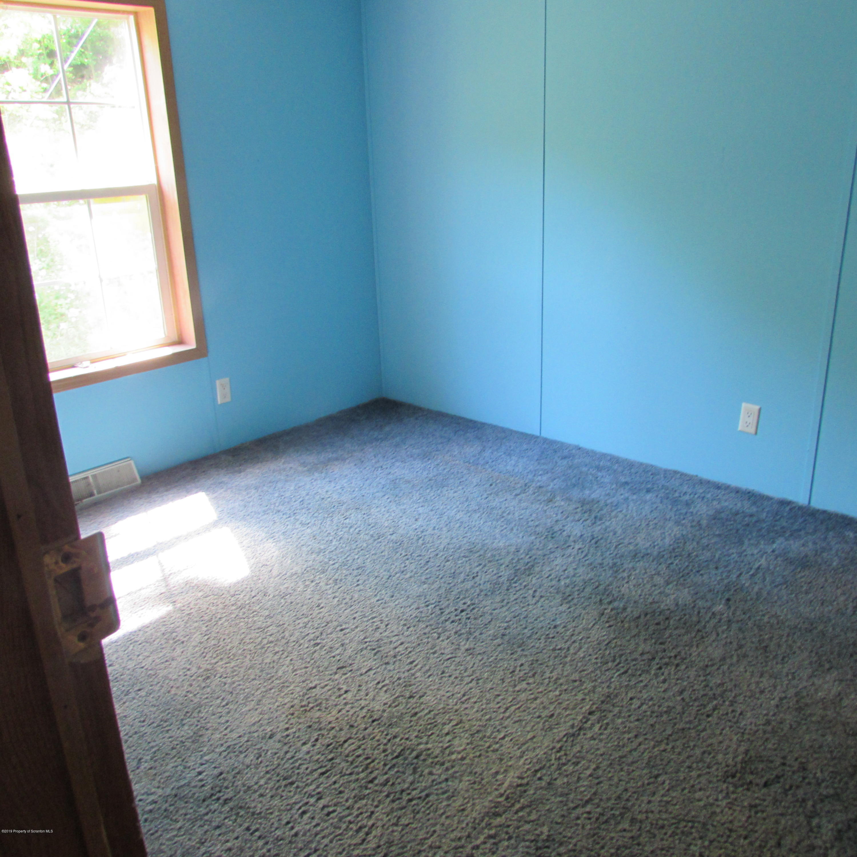 378 Williams Road Meshoppen, PA 18630 - Photo 6 of 8 an empty room with windows