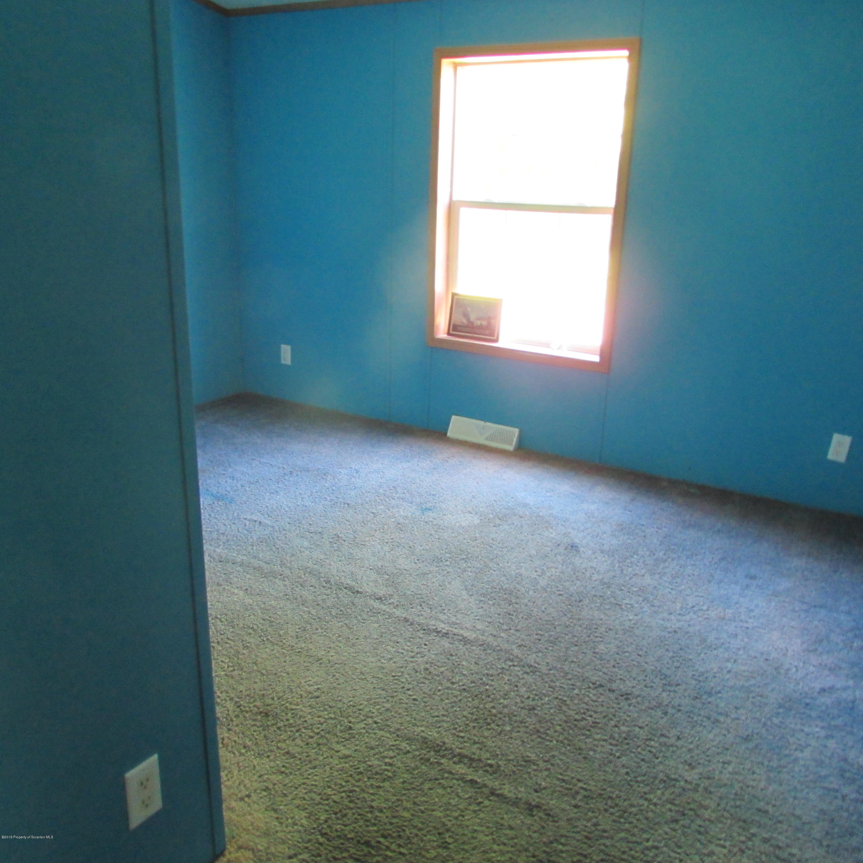 378 Williams Road Meshoppen, PA 18630 - Photo 7 of 8 an empty room with a window