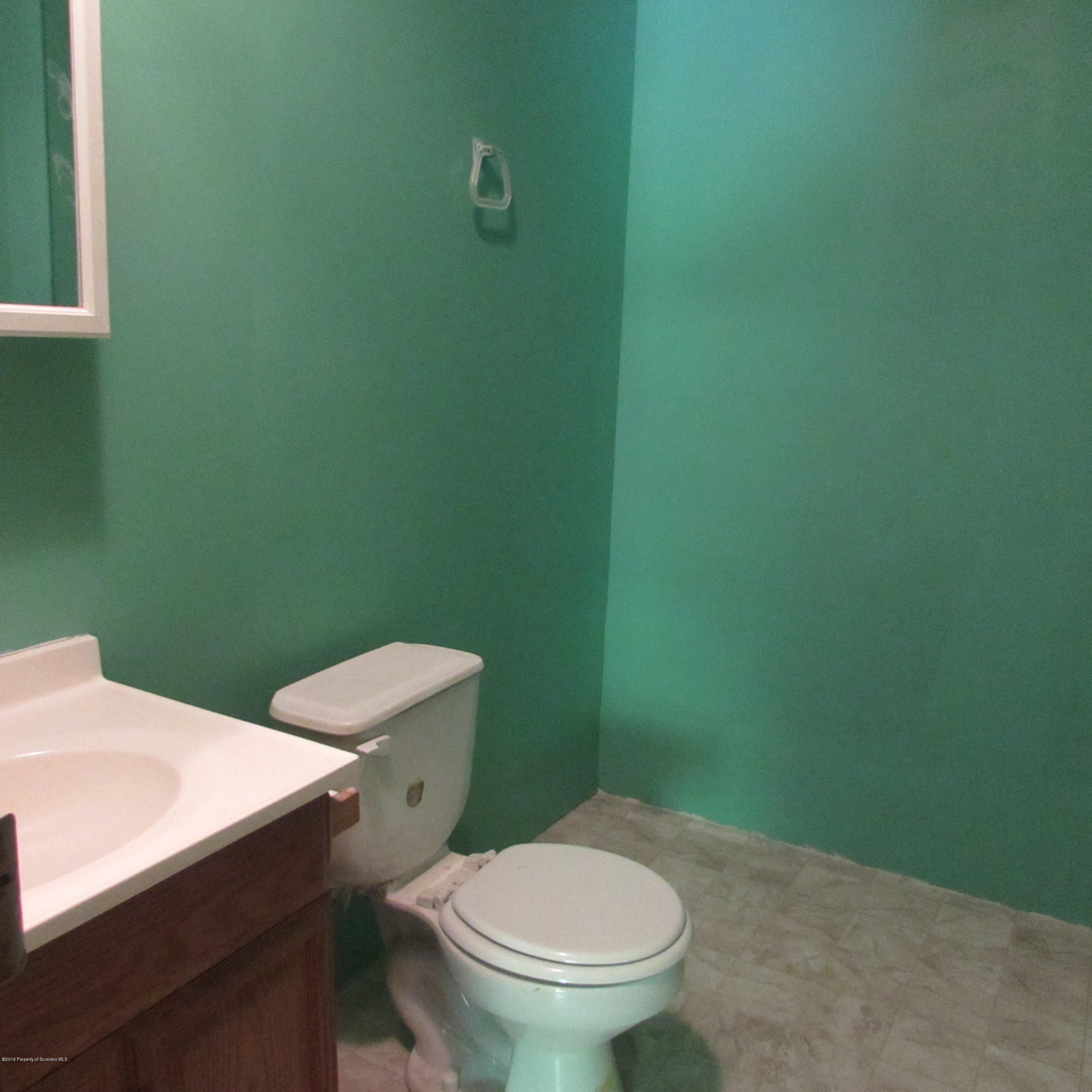 378 Williams Road Meshoppen, PA 18630 - Photo 8 of 8 a white toilet sitting next to a white wall