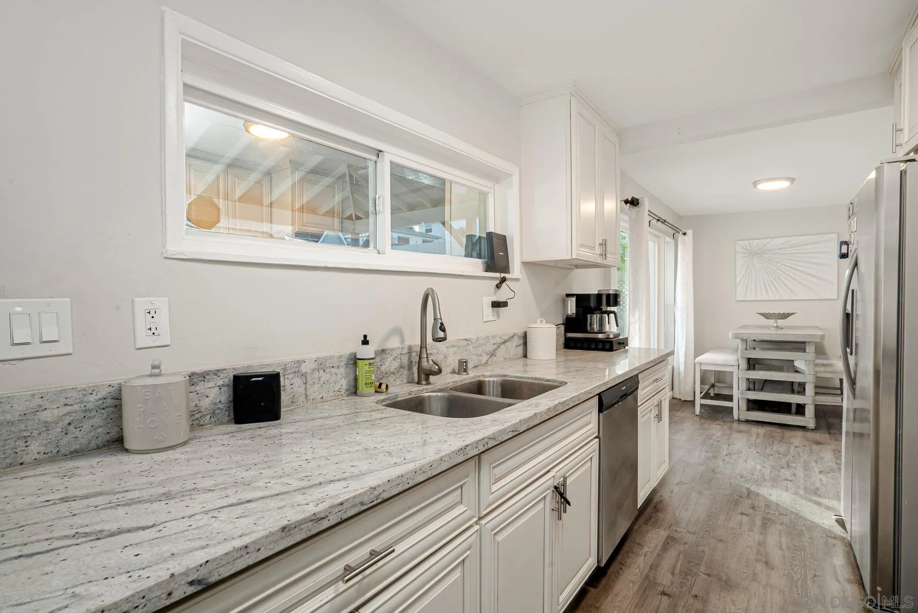 8531 Gardena Road Lakeside, CA 92040 - Photo 11 of 29 a kitchen with a sink and wooden floor