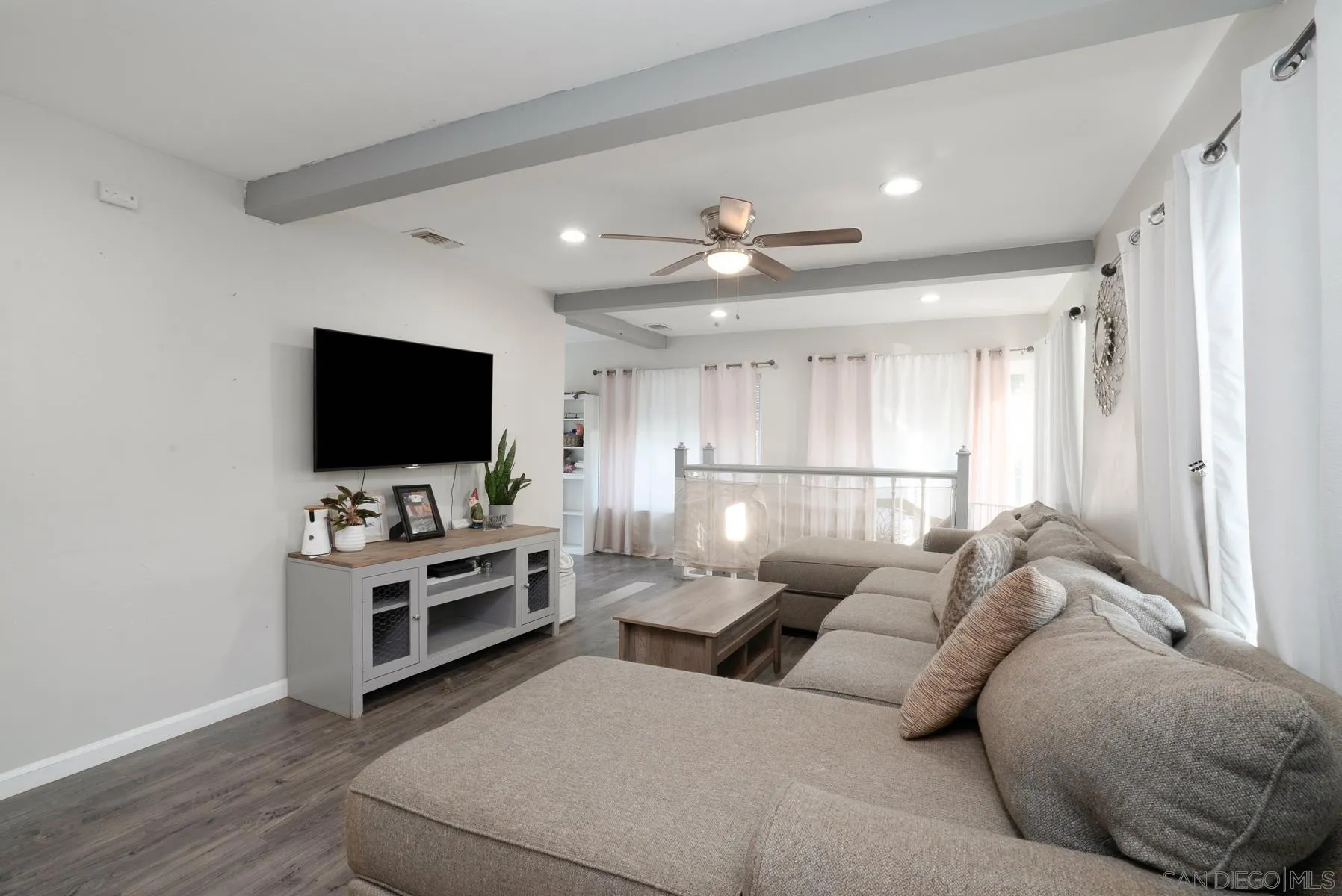 8531 Gardena Road Lakeside, CA 92040 - Photo 12 of 29 a living room with furniture and a flat screen tv