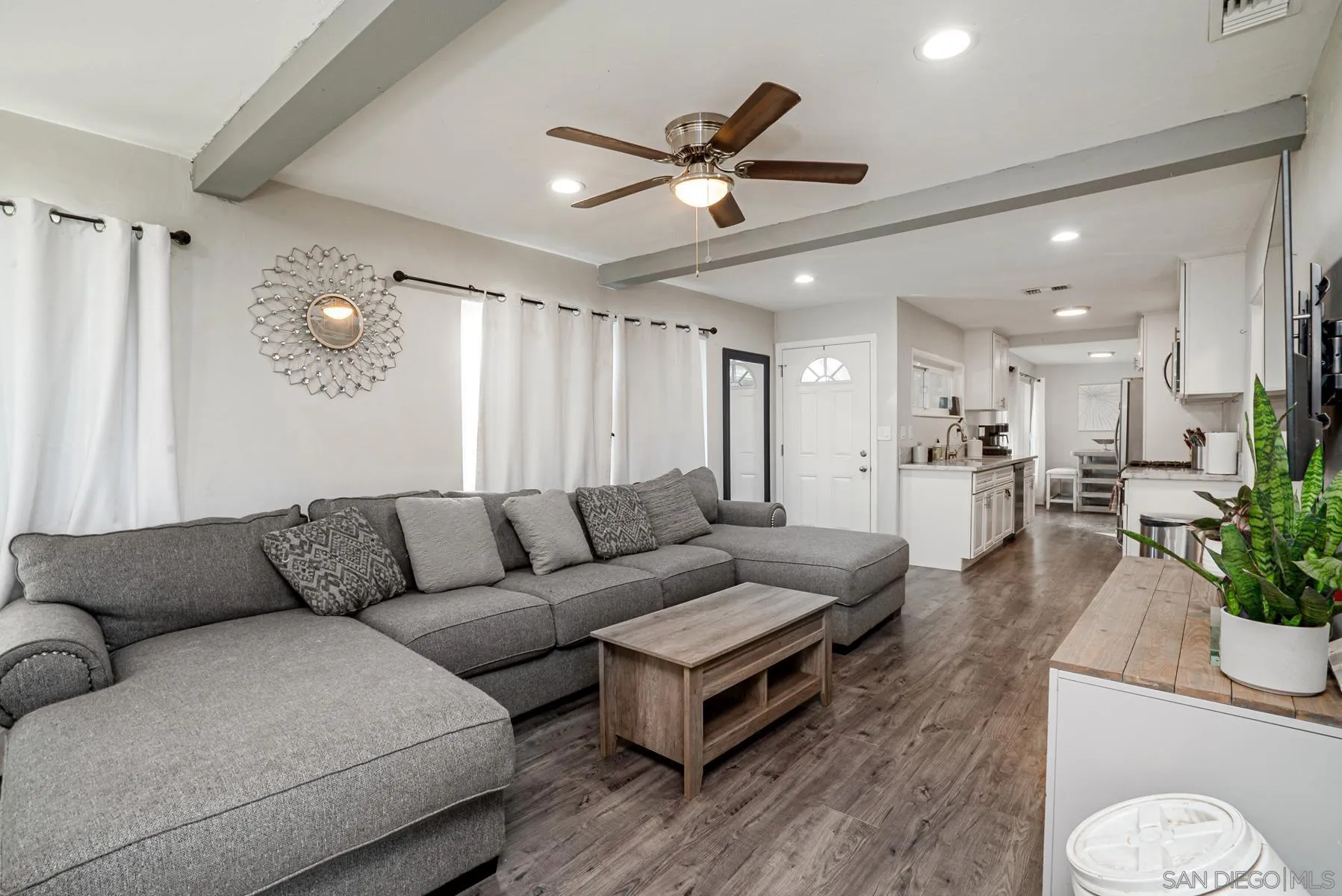 8531 Gardena Road Lakeside, CA 92040 - Photo 14 of 29 a living room with furniture kitchen area and a chandelier