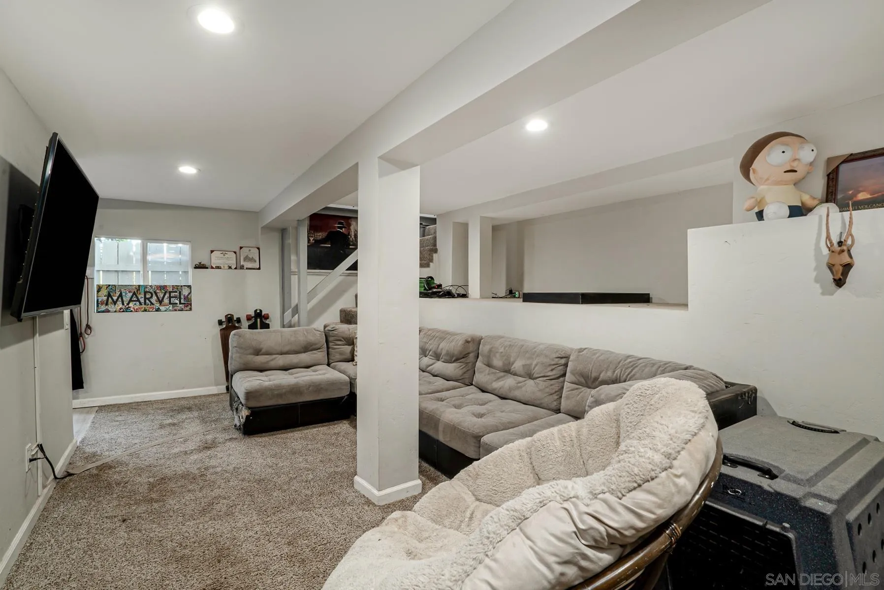 8531 Gardena Road Lakeside, CA 92040 - Photo 17 of 29 a living room with furniture and a flat screen tv