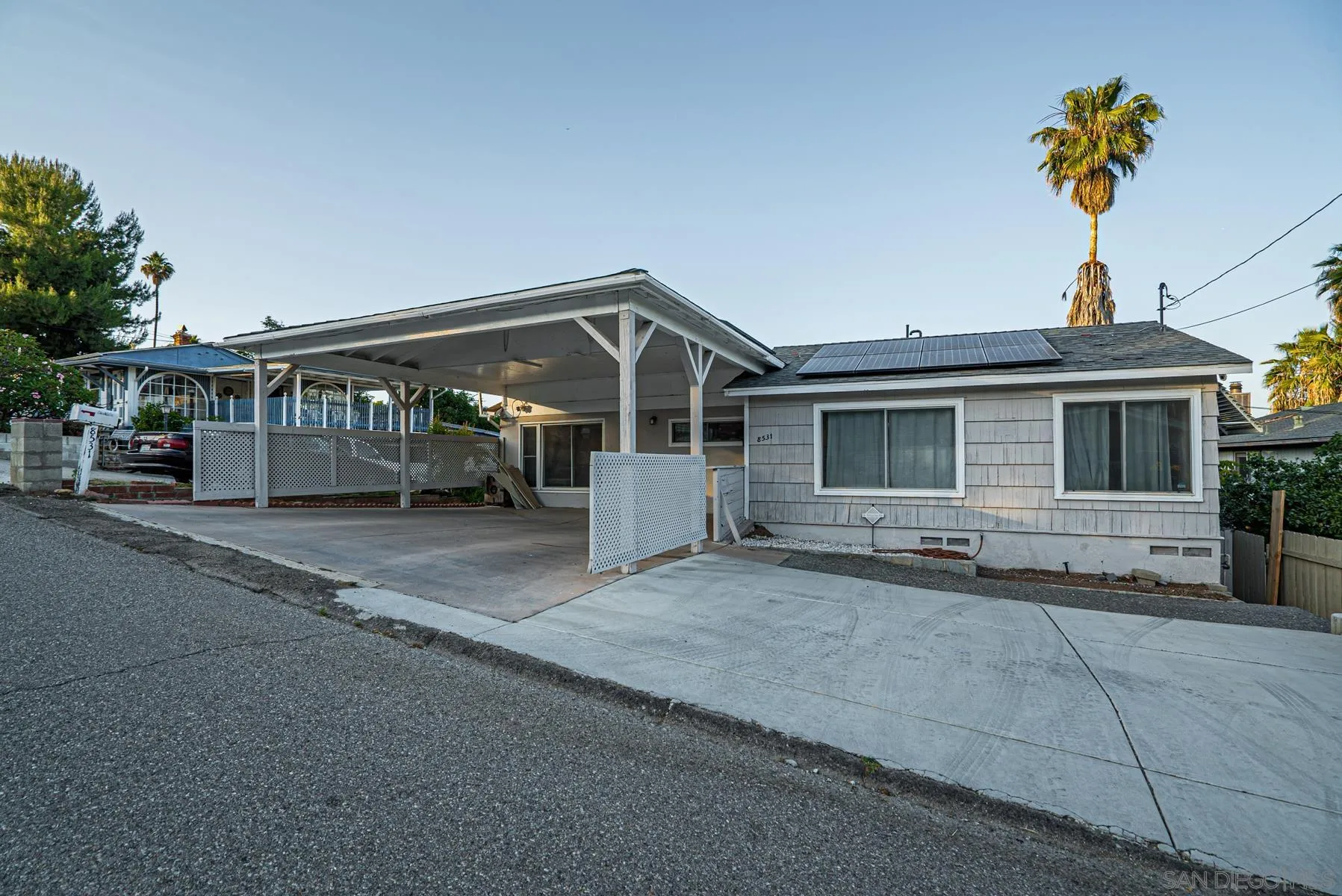 8531 Gardena Road Lakeside, CA 92040 - Photo 2 of 29 a front view of a house with a garden and parking