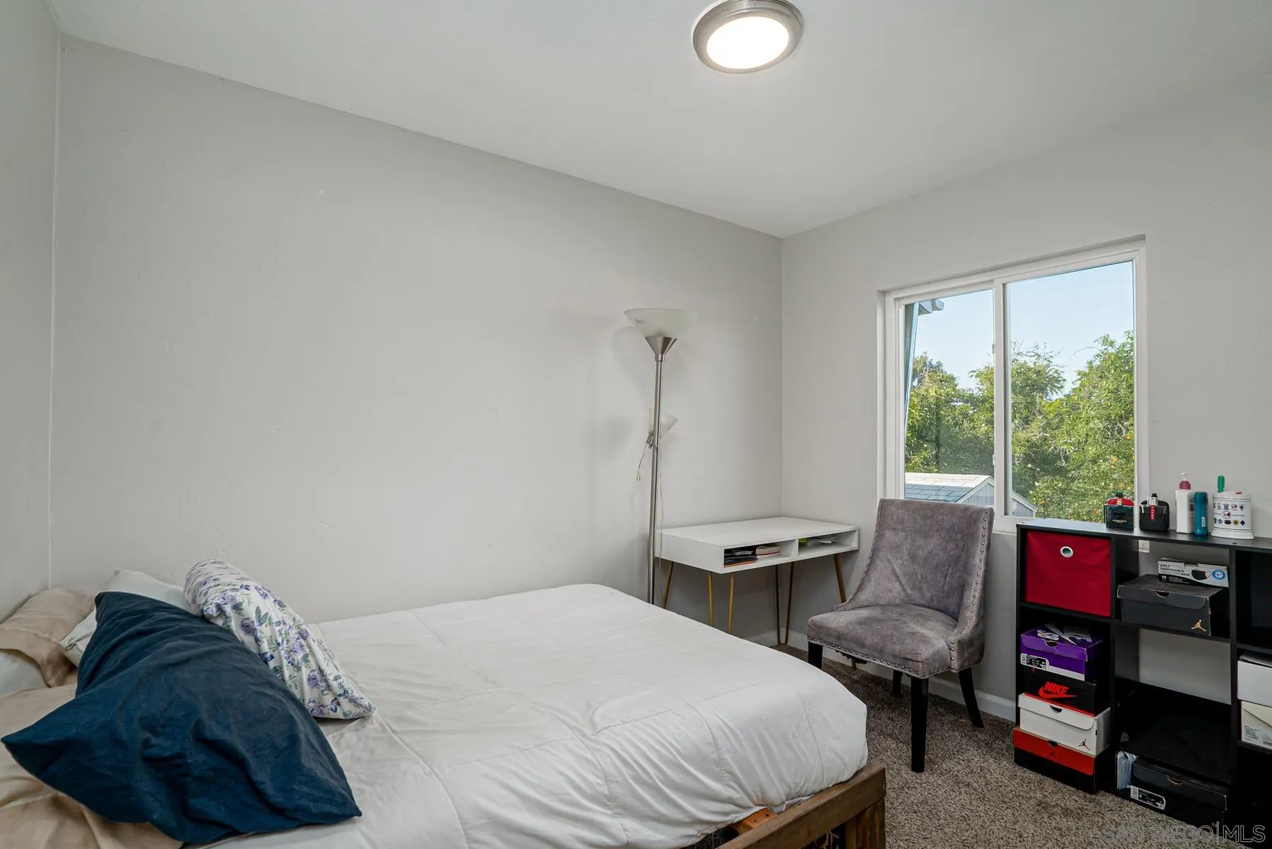 8531 Gardena Road Lakeside, CA 92040 - Photo 3 of 29 a bedroom with a bed and a window