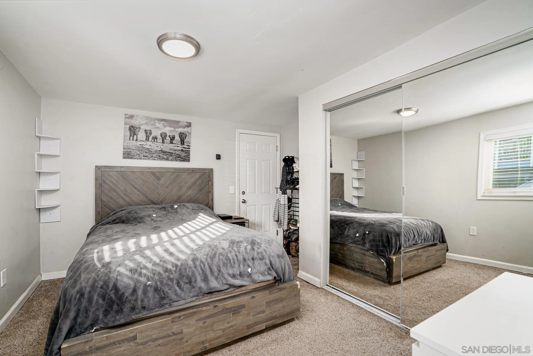 8531 Gardena Road Lakeside, CA 92040 - Photo 6 of 29 a spacious bedroom with a bed and a window