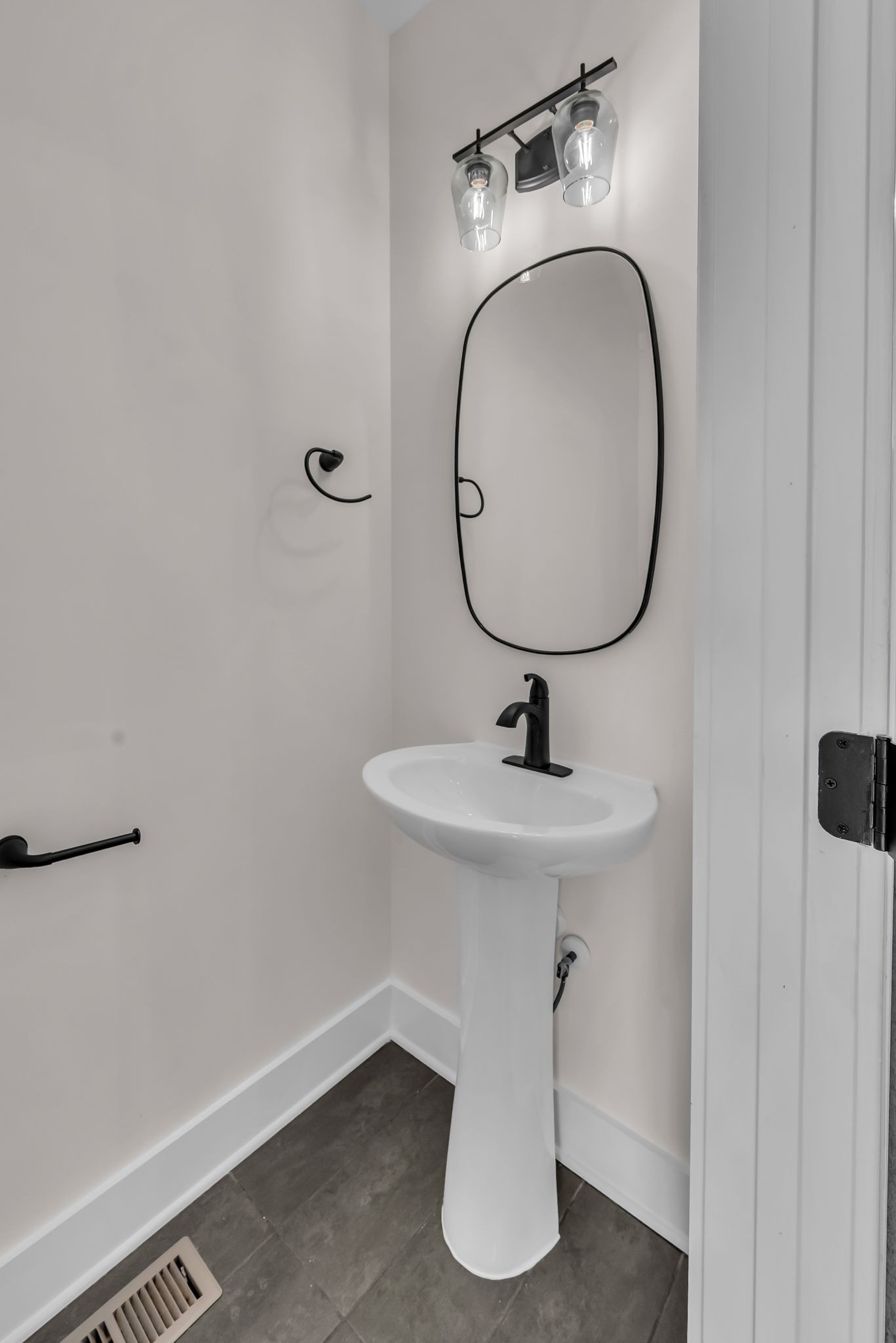 425 Toney Road, Unit B Nashville, TN 37207 - Photo 13 of 14 a bathroom with a sink and a mirror